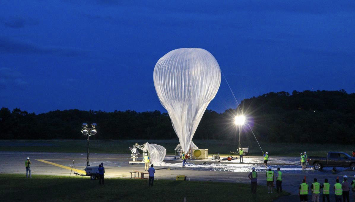 Photo of a High Altitude Balloon preparing for launch at night