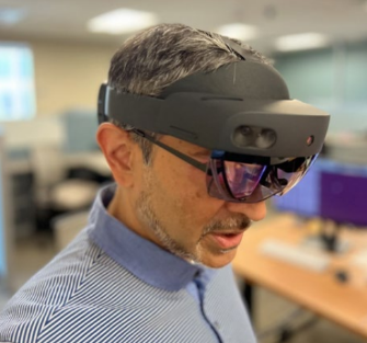 Photo of a man wearing an augmented reality headset